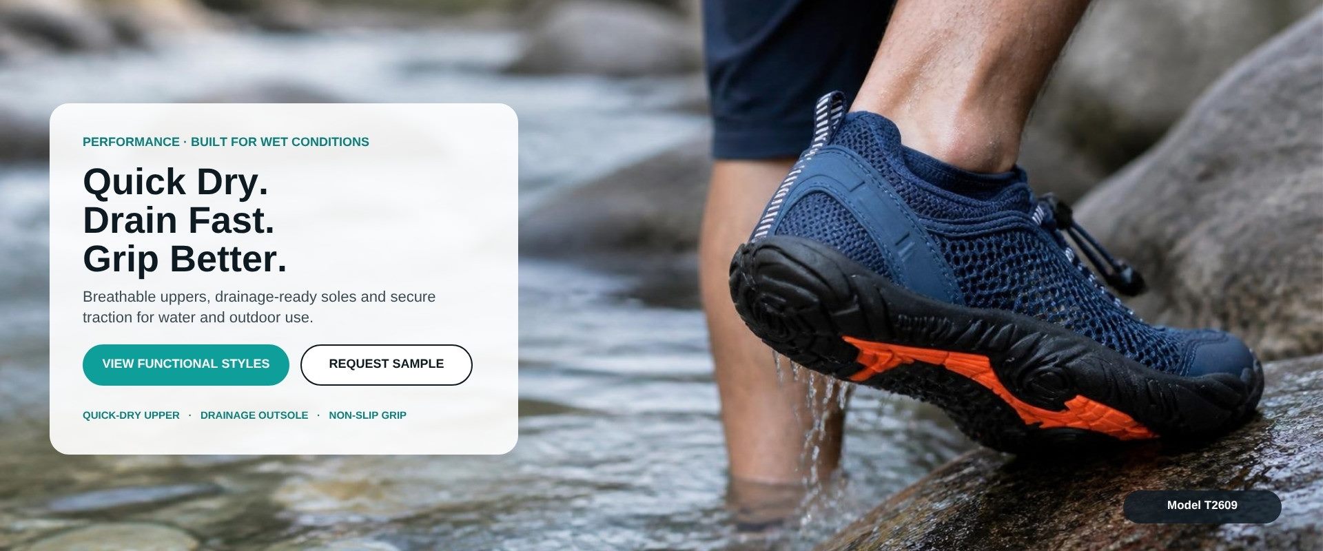 Model T2609 navy creek water shoe on a wet rock, lugged outsole with orange grip insert